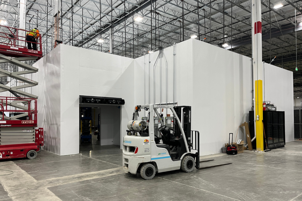 Warehouse with forklift and extended lift