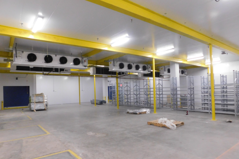 Large, clean empty warehouse with upgraded equipment