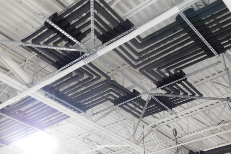 Roof of warehouse showcasing new piping