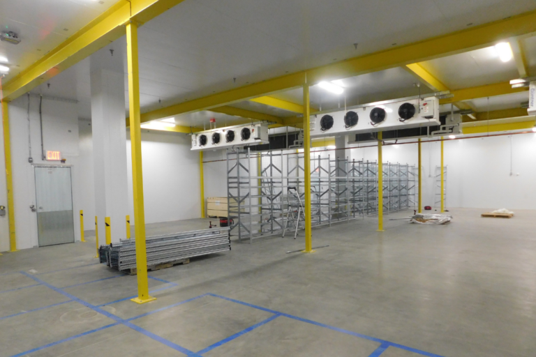 Large, clean empty warehouse with upgraded equipment