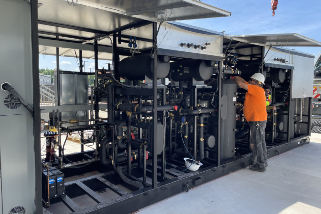 CoolSys technician outside in PPE working on CO2 equipment