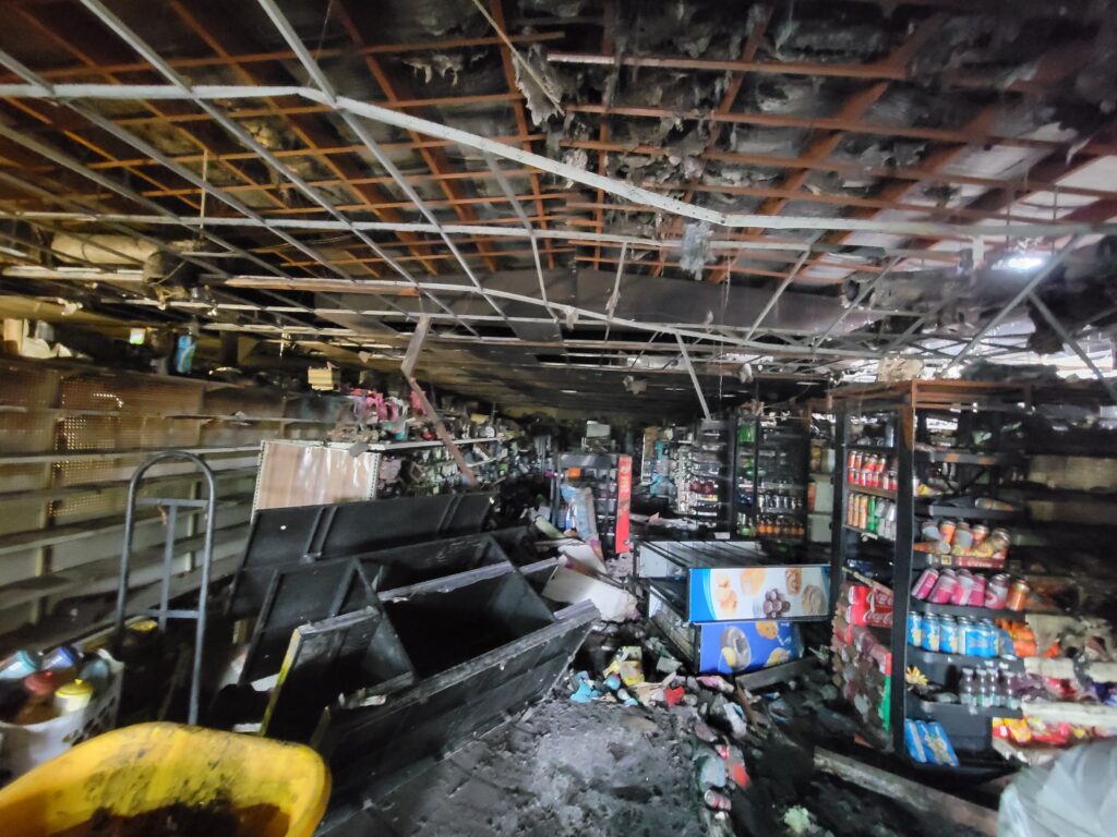 Immediate hurricane damage Retail store in shambles with broken equipment after a large-scale hurricane